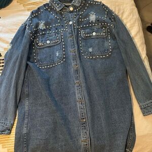 Over sized Long Jean jacket. Distressed and all the bling.